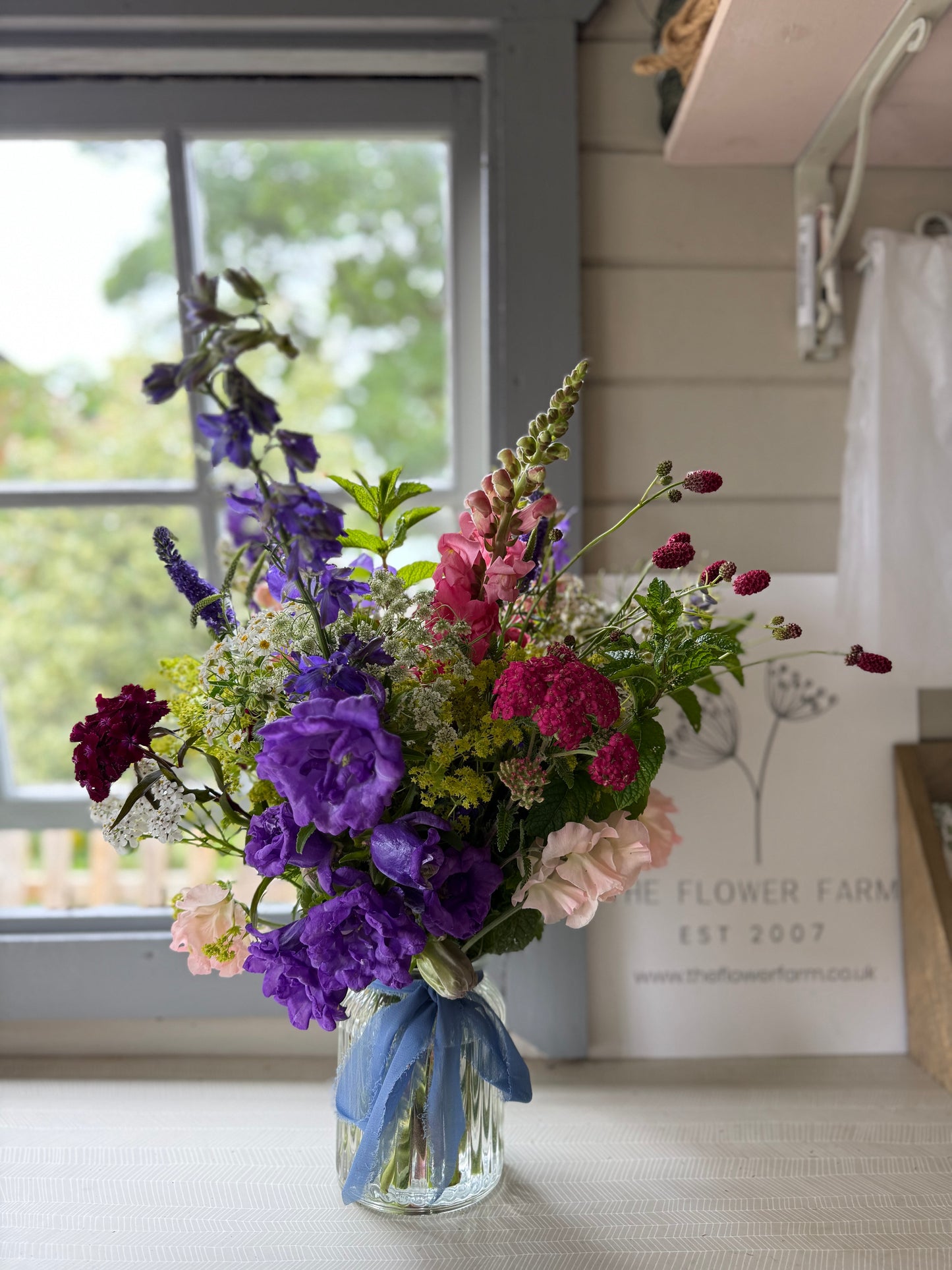 A bouquet of Burscough grown flowers, expertly hand tied and finished off in a pretty glass vase by Flower Farm Floristry.