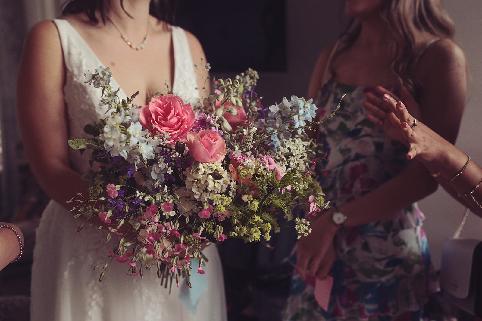 Photo by @TireeDawson of pink, white and blue seasonal English blooms arranged into a bridal bouquet. At Forest Side, Grasmere, Lake District.