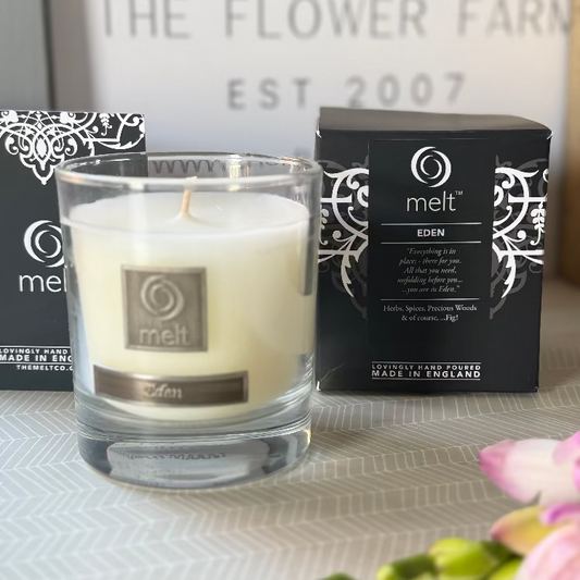 Melt candle in a glass holder with packaging.