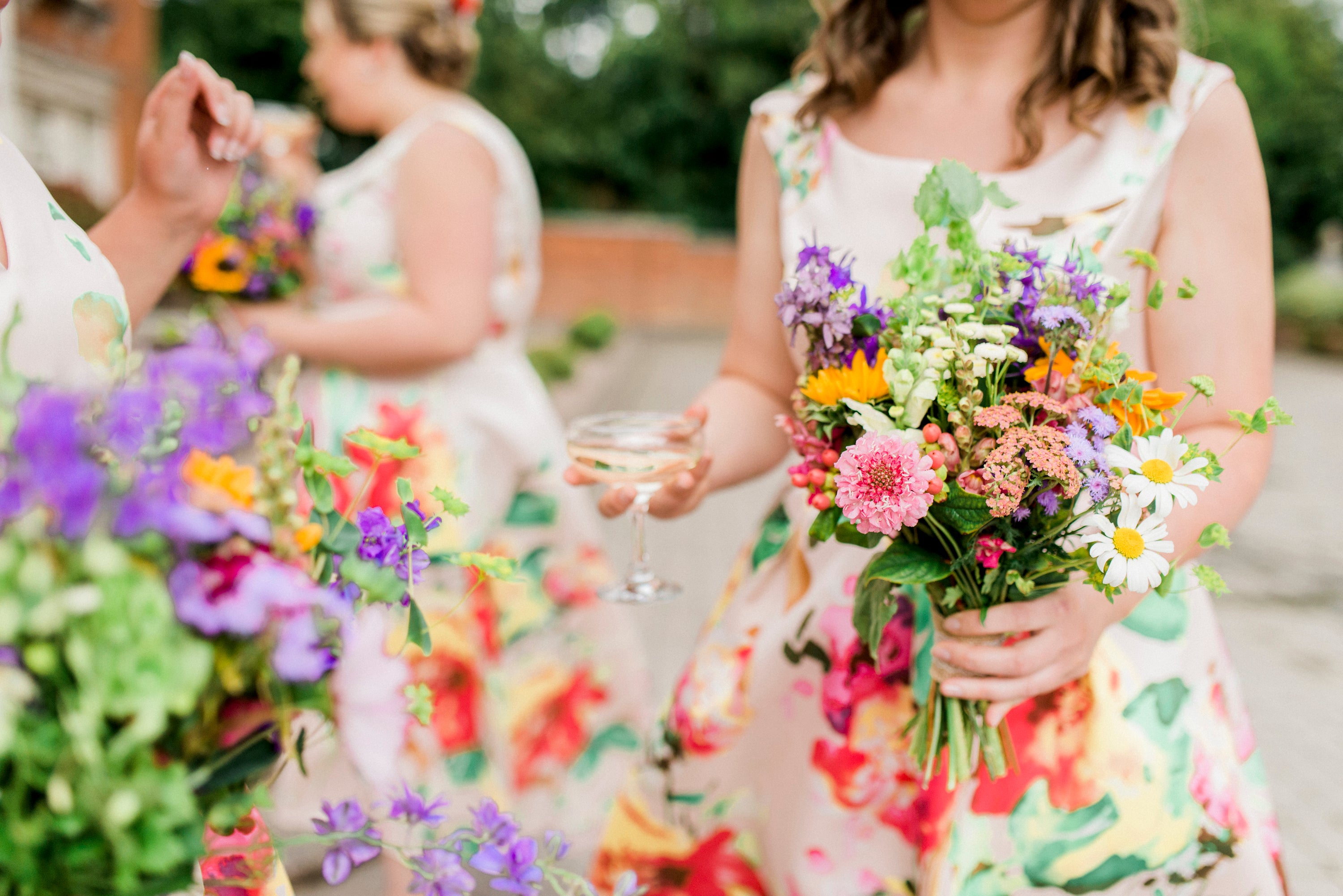 A beautiful summer bridesmaids bouquet of British flowers in a riot of meadow colours, a wildflower style.