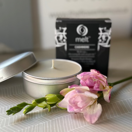 A beautiful scented candle in a tin