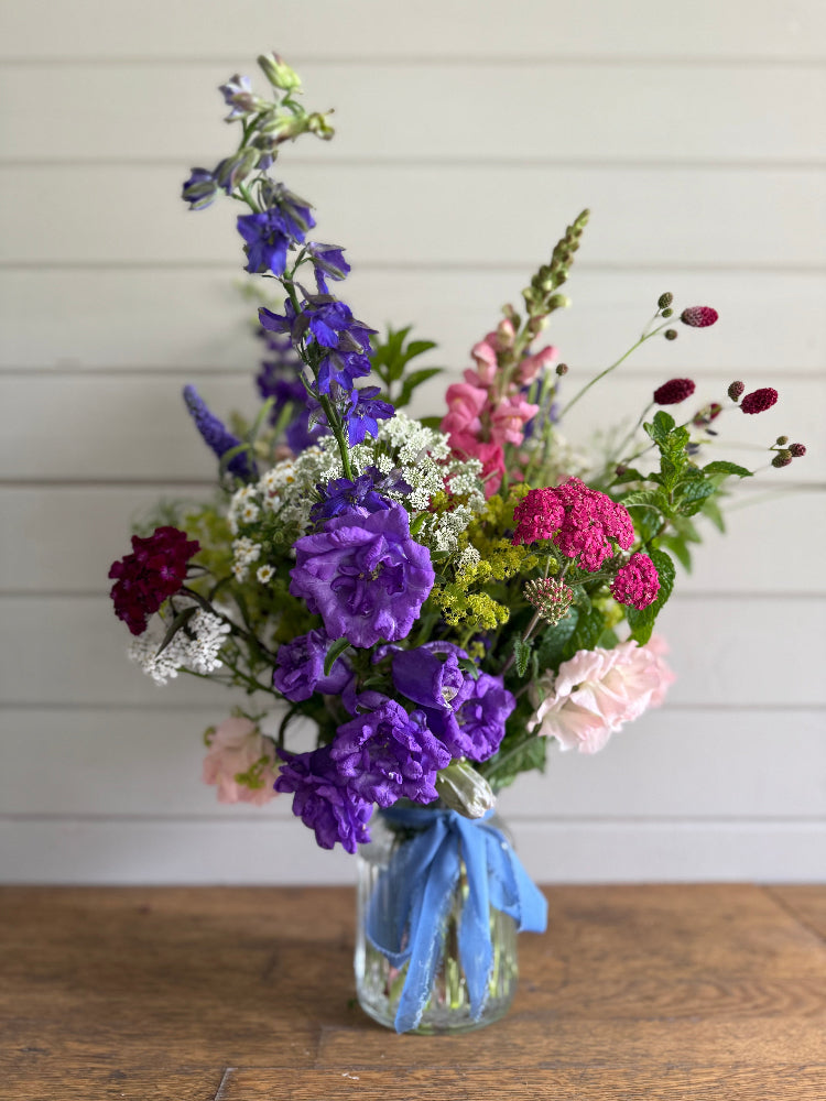 A beautiful Summer mix of British flowers, hand ted and presented in a pretty glass vase. Available for local and national delivery or collection from our flower farm in Burscough.