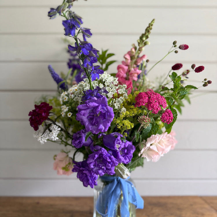 A beautiful Summer mix of British flowers, hand ted and presented in a pretty glass vase. Available for local and national delivery or collection from our flower farm in Burscough.