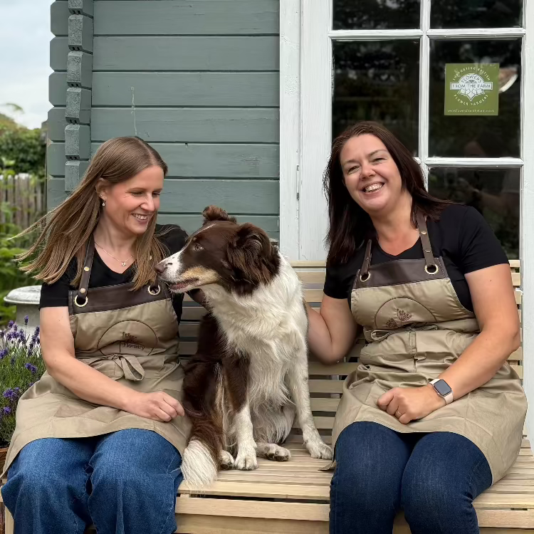 Clare and Alison outside the workshop with the dog at Flower farm Floristry Burscough, Ormskirk, Lancashire. Picture by Millie Rose Content