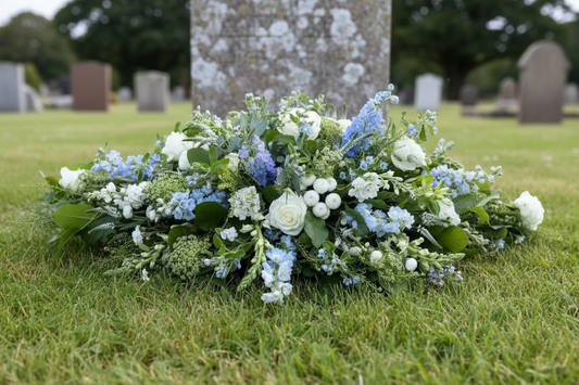 Blue and white flower arrangement for a funeral.