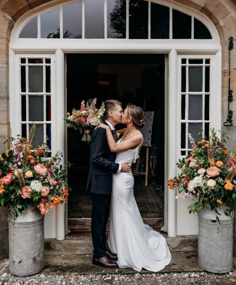 photo by @victoriabakerphotographer of Laura and Joe’s beautiful wedding day. Including milk churn floral designs.