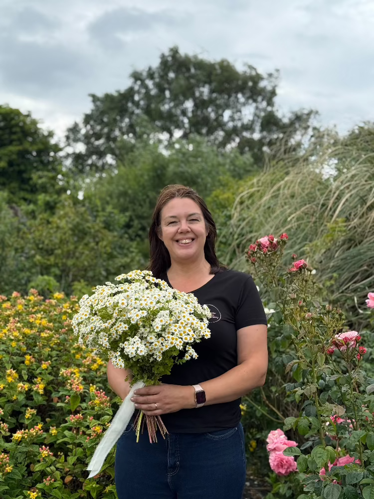 Clare stood in the flower field at Flower Farm Floristry picture by Millie Rose Content