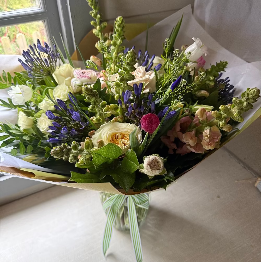 Bouquet of fresh flowers in a glass vase