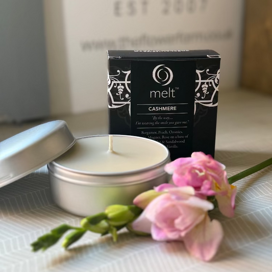 Melt Cashmere candle in a tin 