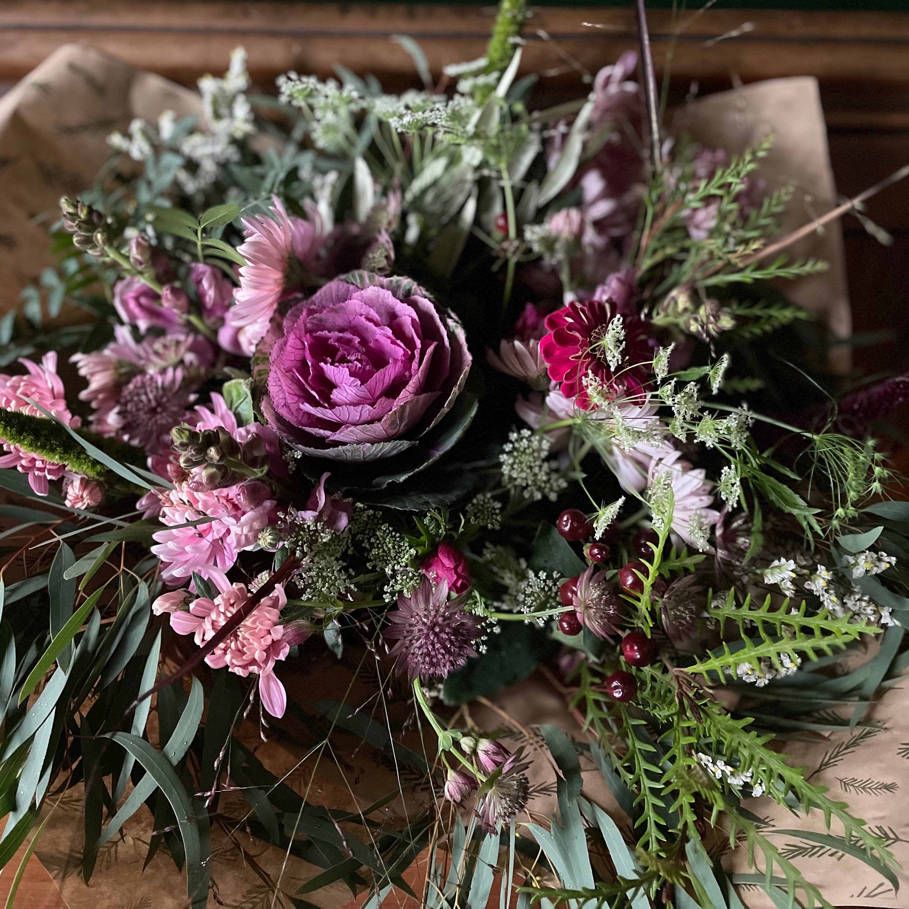 A bouquet of winter flowers including Brassica and Chrysanthemums